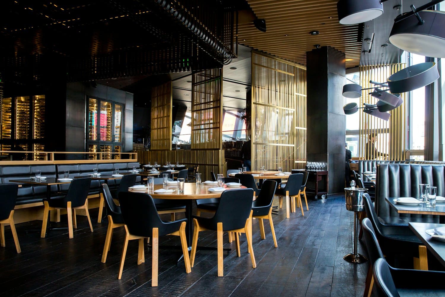 Guests dining in a warm, modern restaurant